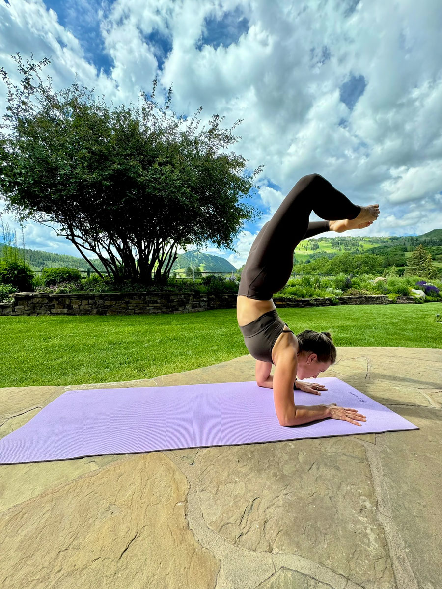 The coach is doing yoga.